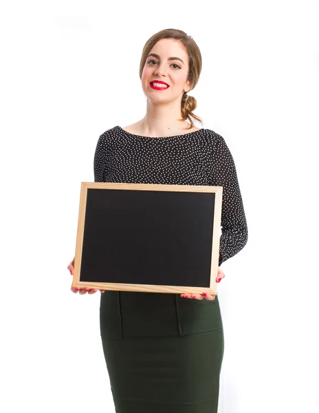 Young girl holding a blackboard — Stock Photo, Image