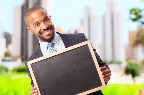 Jonge cool zwarte man met een schoolbord — Stockfoto