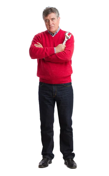 Satisfied man holding a wrench — Stock Photo, Image