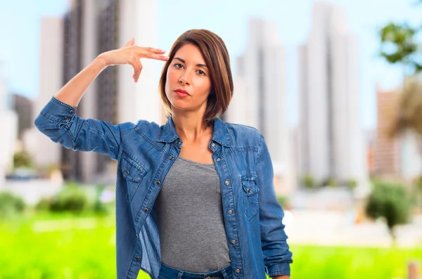 Young cool woman suicide sign — Stock Photo, Image