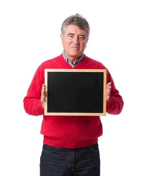 Hombre feliz sosteniendo una pizarra — Foto de Stock