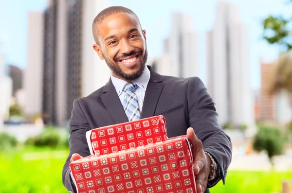 Young cool black man with boxes — Stock Photo, Image
