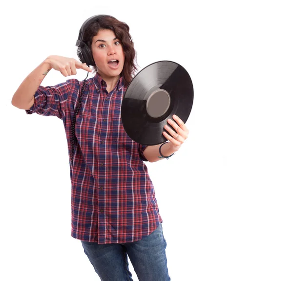 Grappig meisje met een koptelefoon en een vinyl — Stockfoto