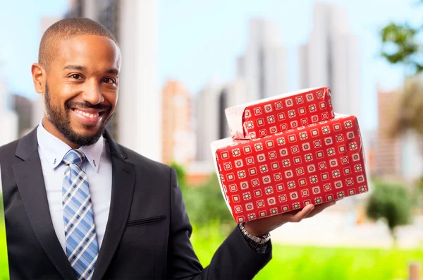 Young cool black man with boxes — Stock Photo, Image