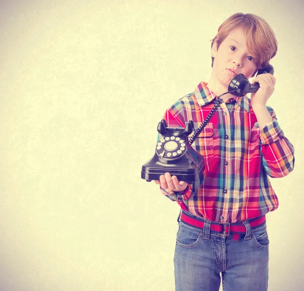 Worried boy talking by telephone — Stock Photo, Image