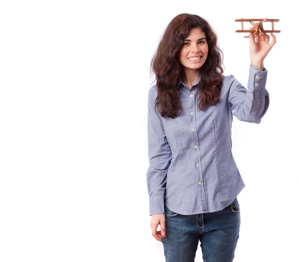 Happy girl holding a wood plane — Stock Photo, Image