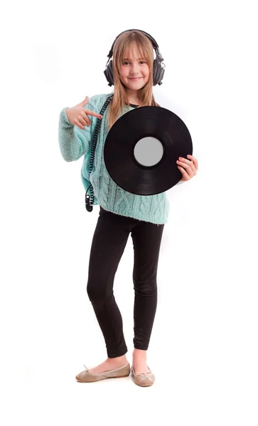 Ung flicka med hörlurar och vinyl — Stockfoto