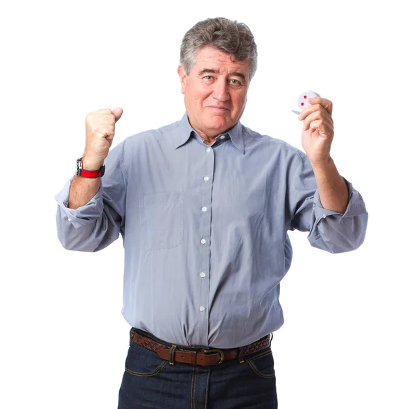 Winner man holding a die — Stock Photo, Image