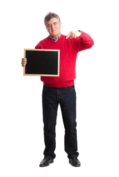 Homem satisfeito segurando um quadro negro — Fotografia de Stock