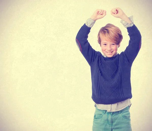 Child celebrating with arms up — Stock Photo, Image