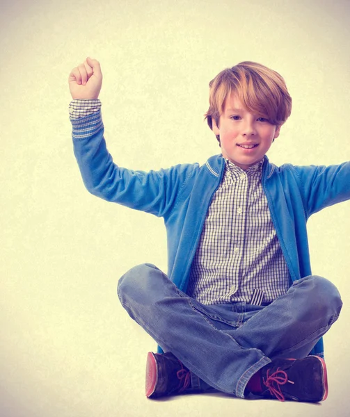 Child sitting and celebrating — Stock Photo, Image