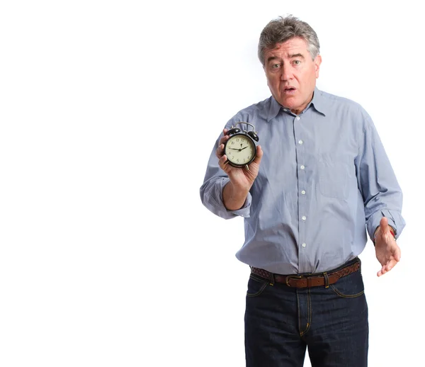Surprised man with an alarm clock — Stock Photo, Image