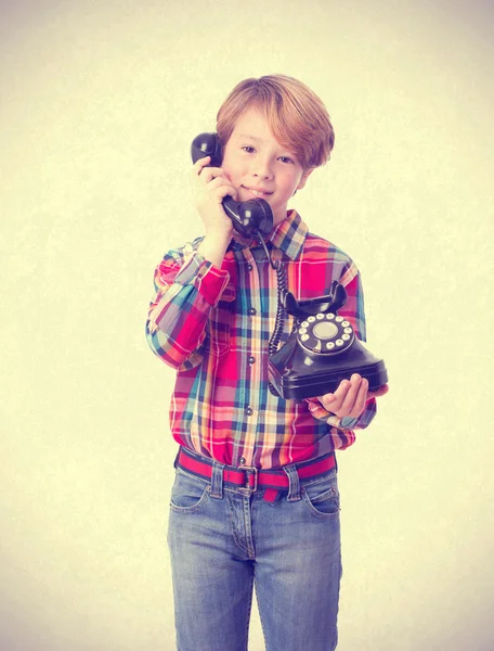 Happy child talking by telephone — Stock Photo, Image
