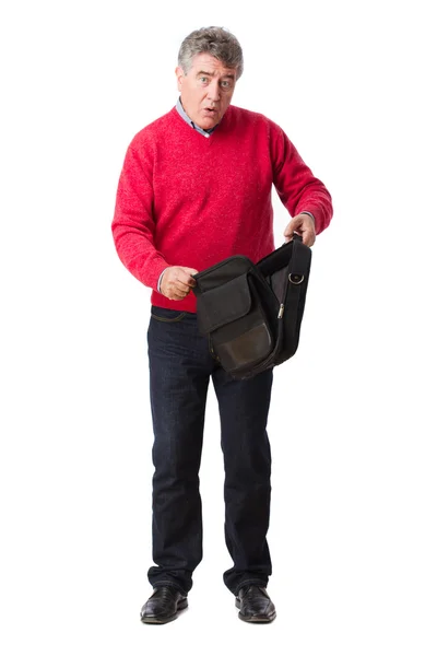 Surprised man opening a baggage — Stock Photo, Image