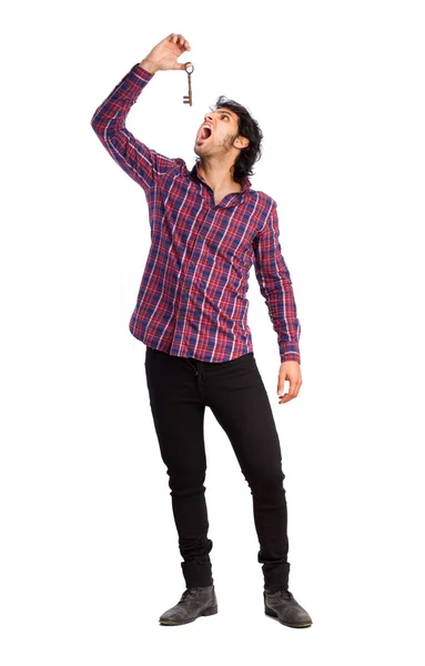 Hindu cool young man with a key — Stock Photo, Image