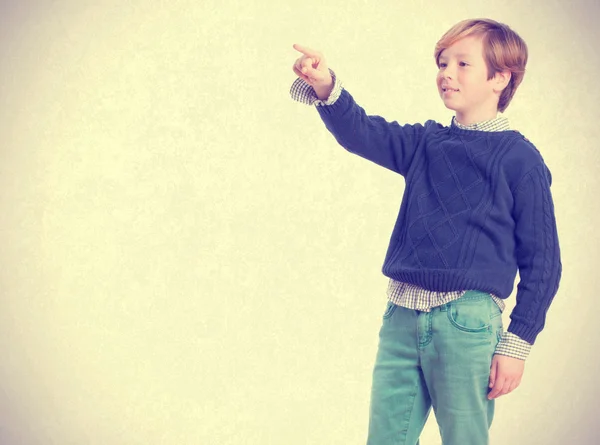 Happy boy pointing — Stock Photo, Image