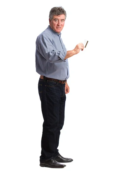 Satisfied man holding a credit card — Stock Photo, Image