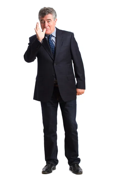 Businessman mischief gesture — Stock Photo, Image