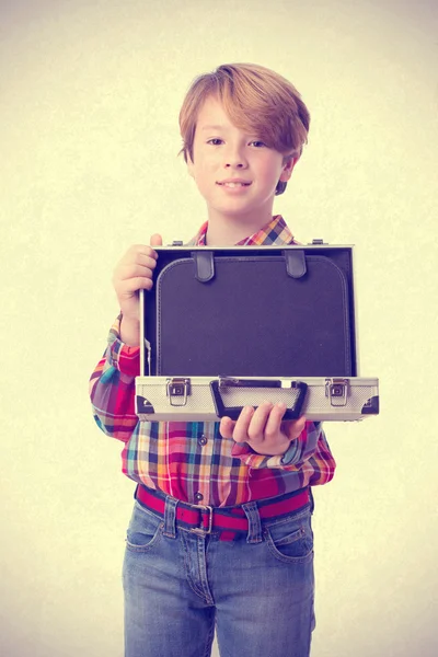 Happy boy holding a briefcase — Stock Photo, Image