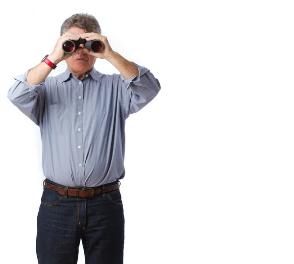 Man observing with a binoculars — Stock Photo, Image