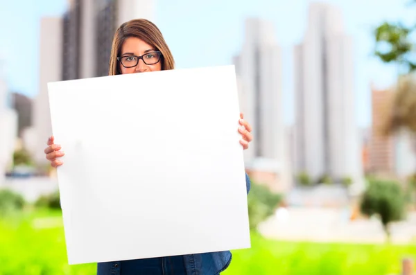 Young cool woman with a placard — Stock Photo, Image