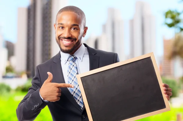 Young cool black man with a blackboard — Stock Photo, Image
