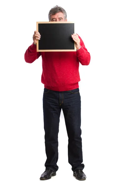 Man holding a blackboard — Stock Photo, Image