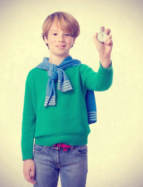 Satisfied child holding a timer — Stock Photo, Image