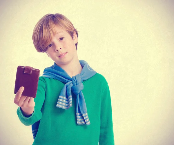 Doubtful child holding a leather wallet — Stock Photo, Image