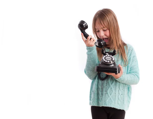 Jong meisje met een telefoon — Stockfoto