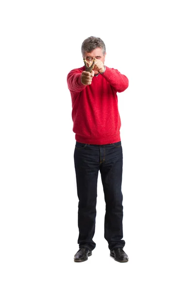 Man pointing with a slingshot — Stock Photo, Image