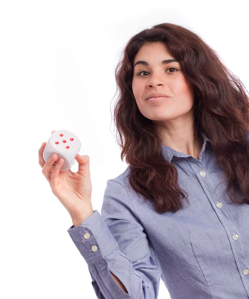 Ragazza pensierosa che tiene un dado — Foto Stock