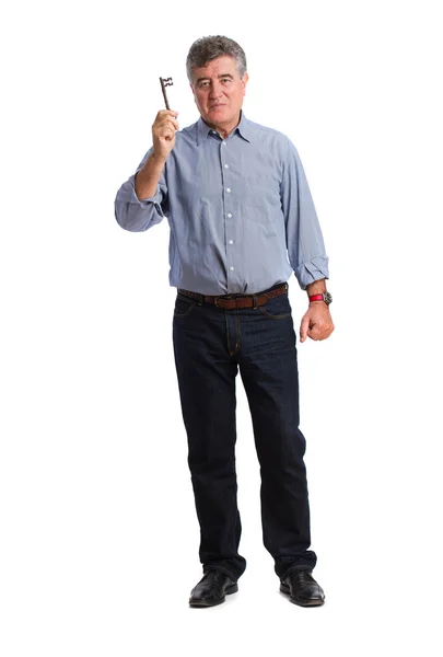 Happy man holding a key — Stock Photo, Image