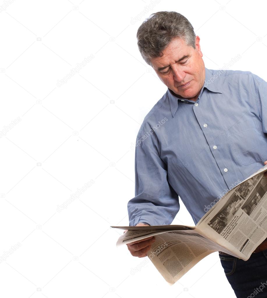 Thoughtful man reading a newspaper