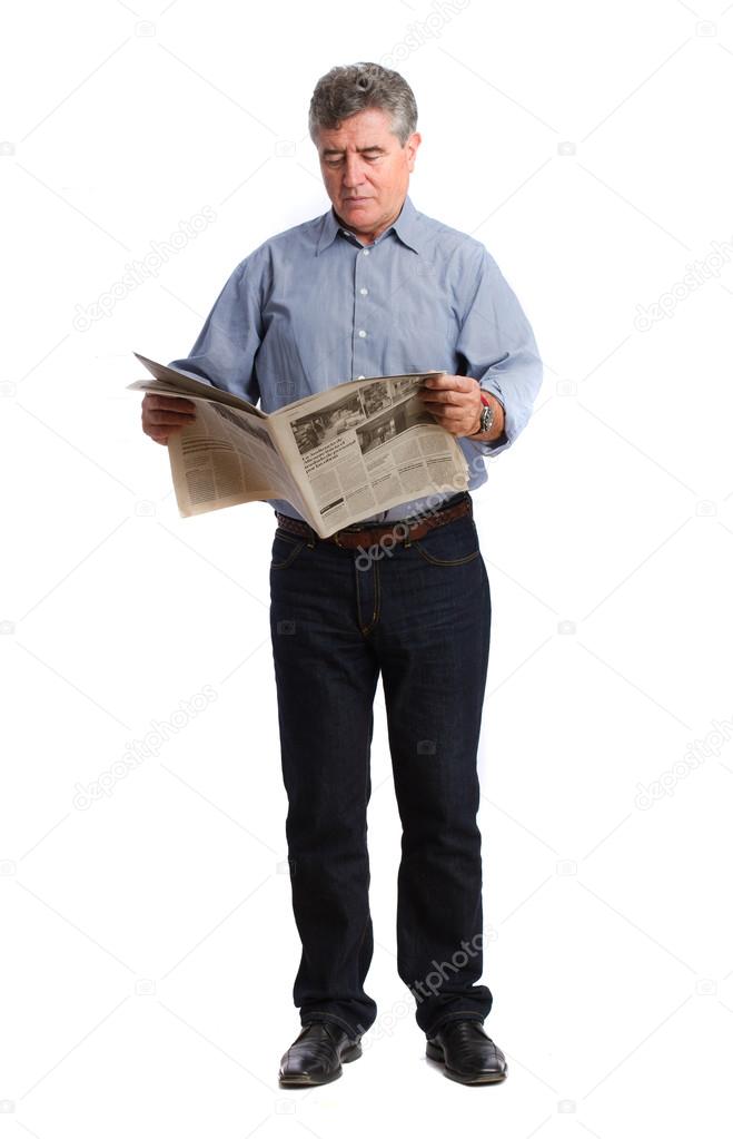 Concentrated man reading a newspaper