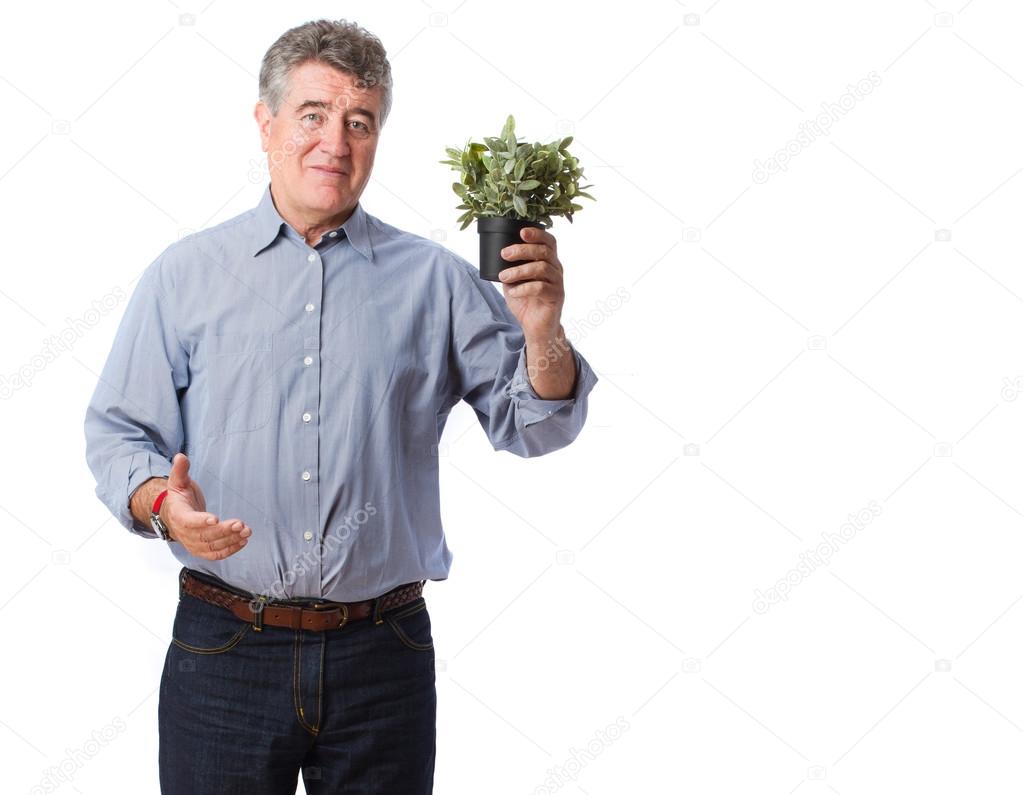 Man holding a plant