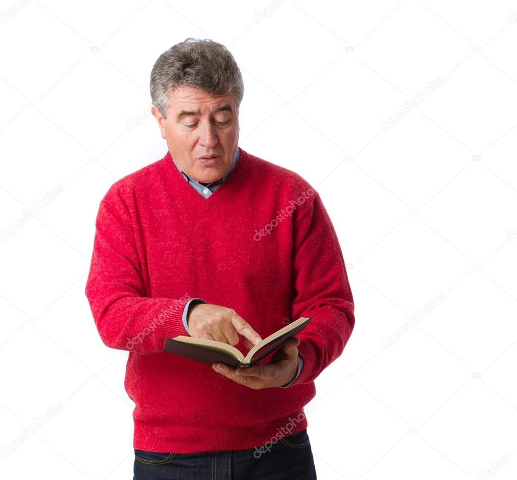 Surprised man reading a book