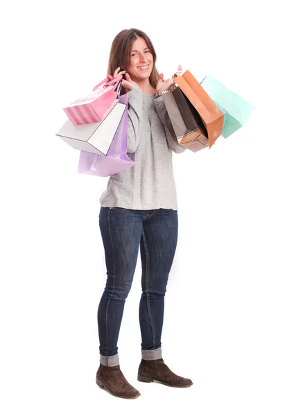 Tevreden meisje met een shopping tassen — Stockfoto