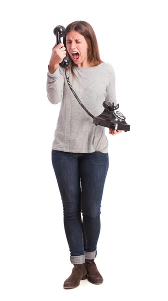 Menina irritada gritando com um telefone — Fotografia de Stock