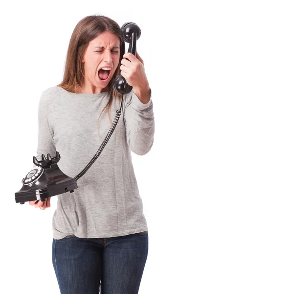 Boos meisje met een telefoon — Stockfoto