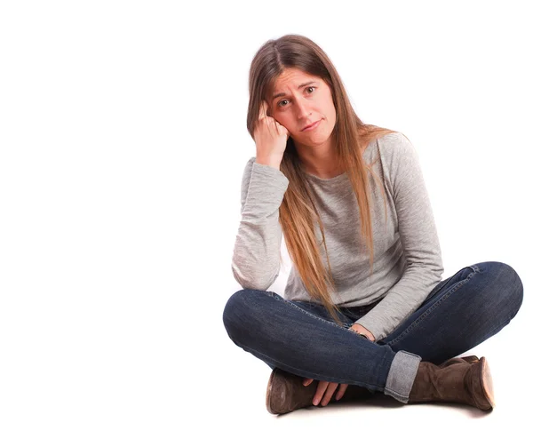 Pensive girl sitting — Stock Photo, Image