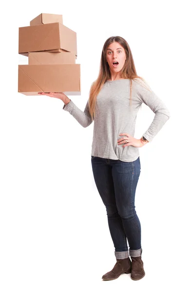 Surprised girl with a cardboard boxes — Stock Photo, Image