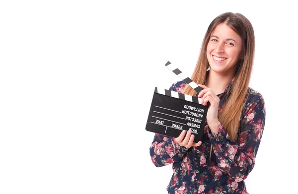 Happy girl holding a clapperboard — Stock Photo, Image