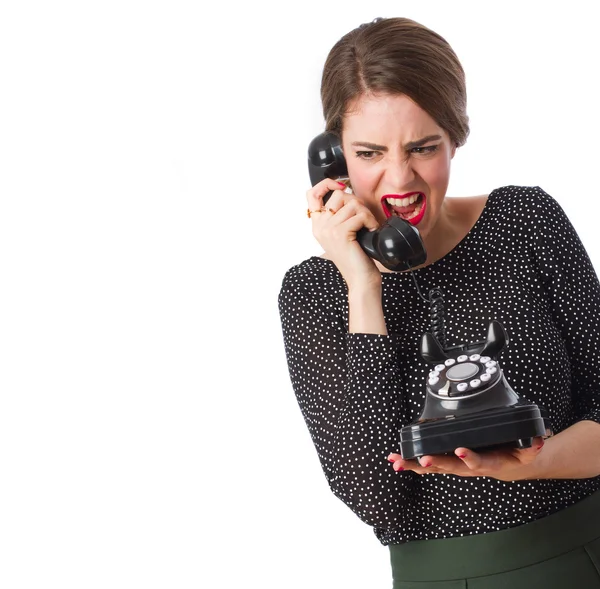 Menina irritada com um telefone — Fotografia de Stock