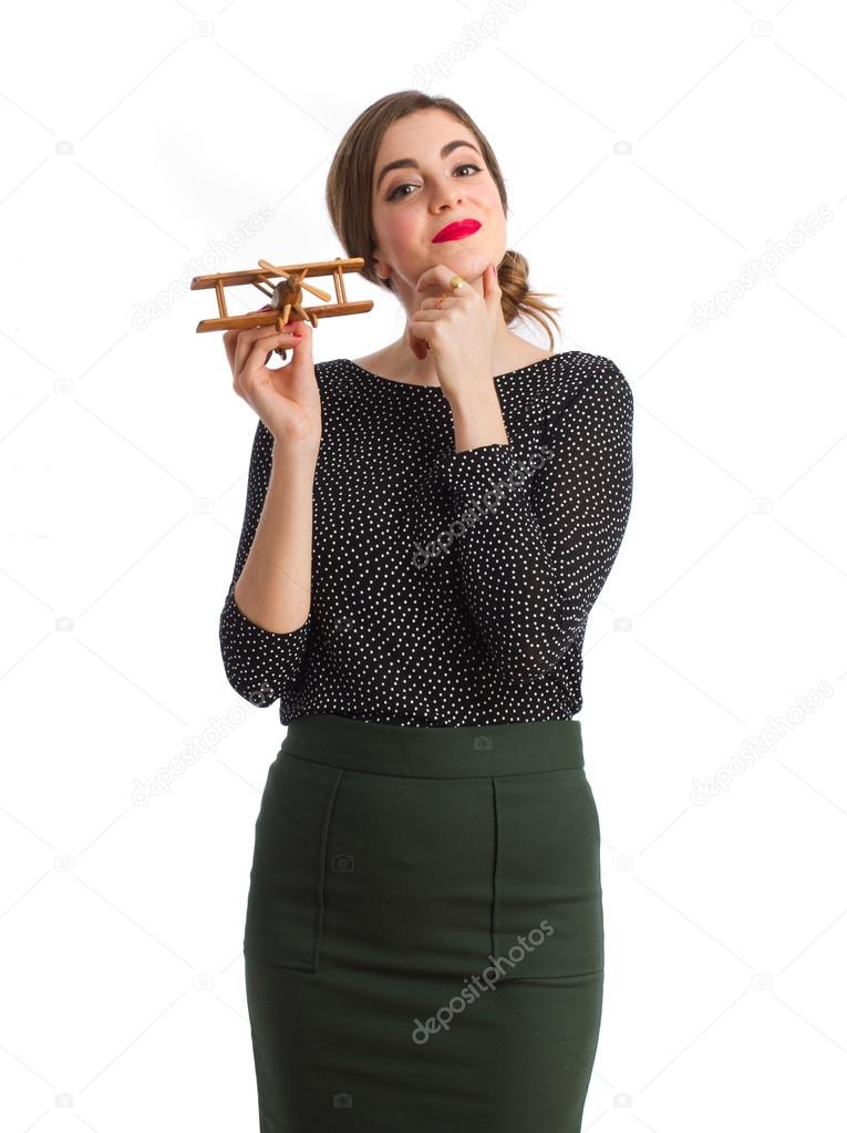 Young woman with a wood plane