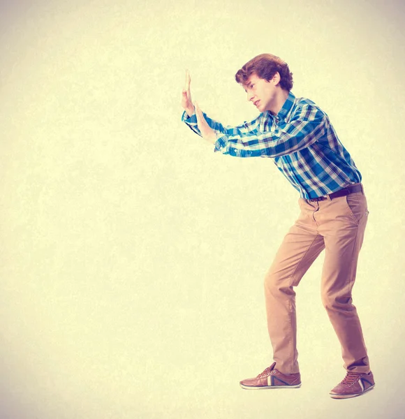 Young boy pushing gesture — Stock Photo, Image