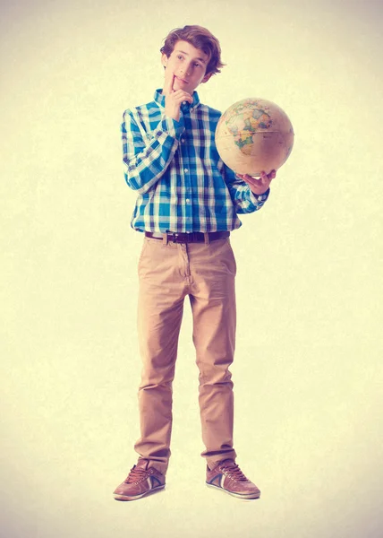 Teenager holding a world globe — Stock Photo, Image