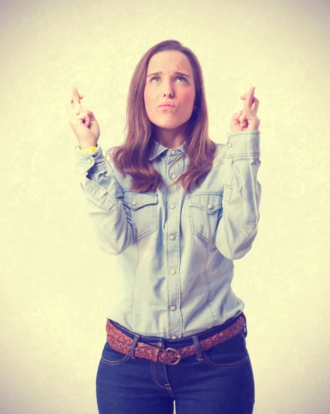 Young girl finger cross gesture — Stock Photo, Image