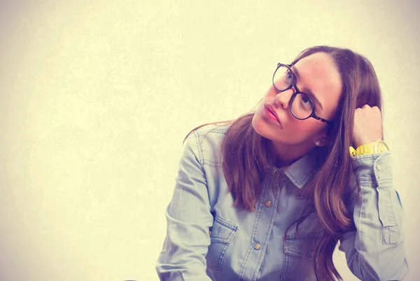 Thinking young girl. isolated — Stock Photo, Image