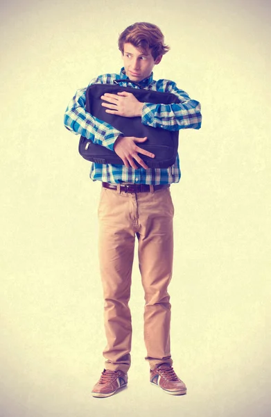 Teenager holding a suitecase — Stock Photo, Image